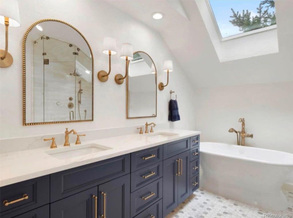 Elegant bathroom with blue cabinets