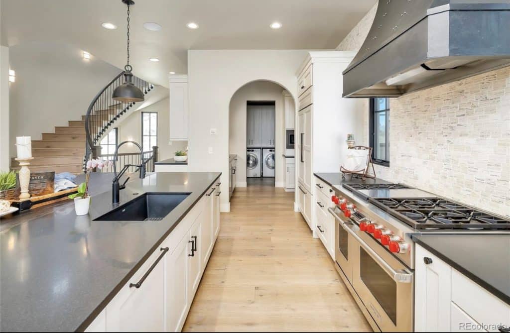 Spiral staircase next to kitchen